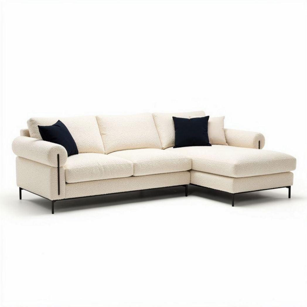 Cotton upholstered sectional sofa in cream fabric with black accent pillows
