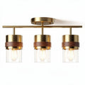 Three-light industrial style ceiling fixture with glass shades and wooden accents